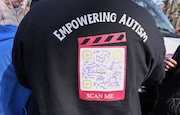Participants of the Grace Foundation of New York celebrated World Autism Awareness Day by breaking the world's record for most awareness ribbons on their van which numbered 12,000 on April 2,2025 at their location on Brielle Ave. (Steve White for the Staten Island Advance)